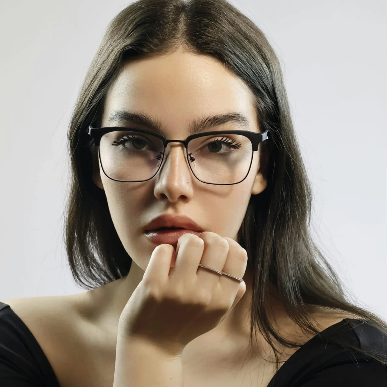 A customer wearing designer eyewear from Mega Save Optical
